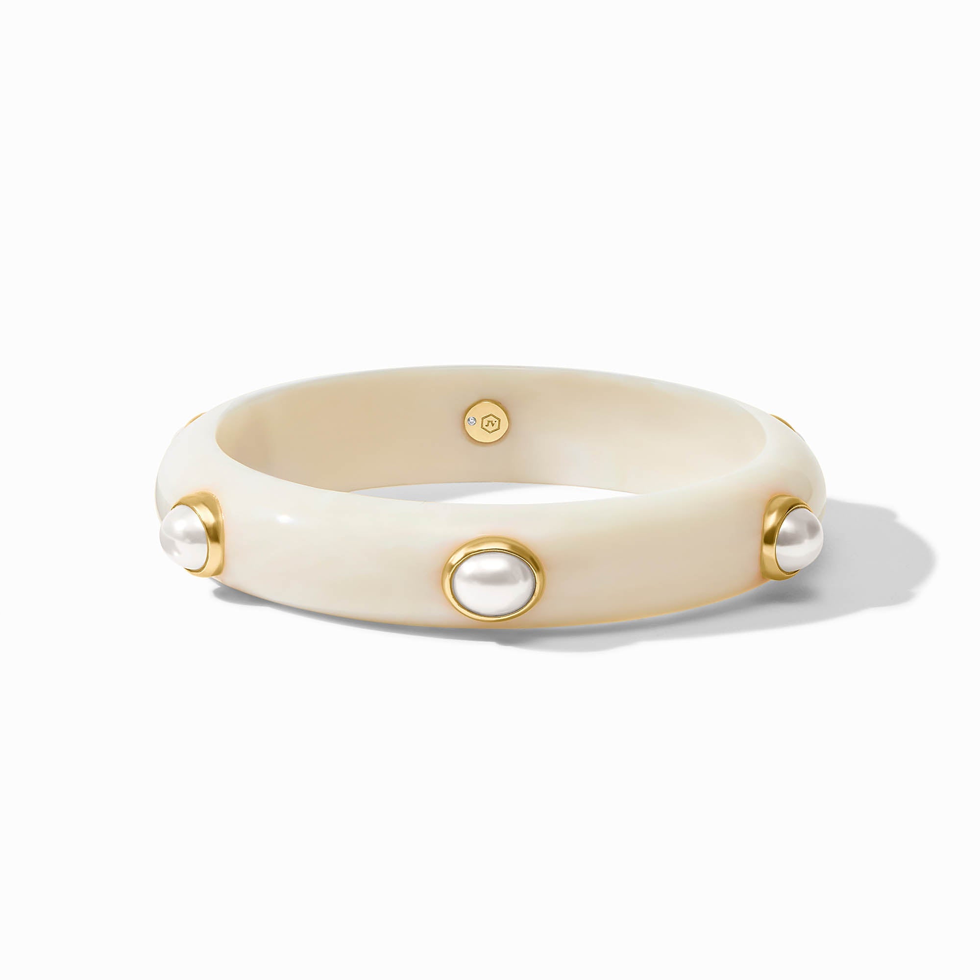 Beige bracelet with gold accents and pearl-like beads on a white background