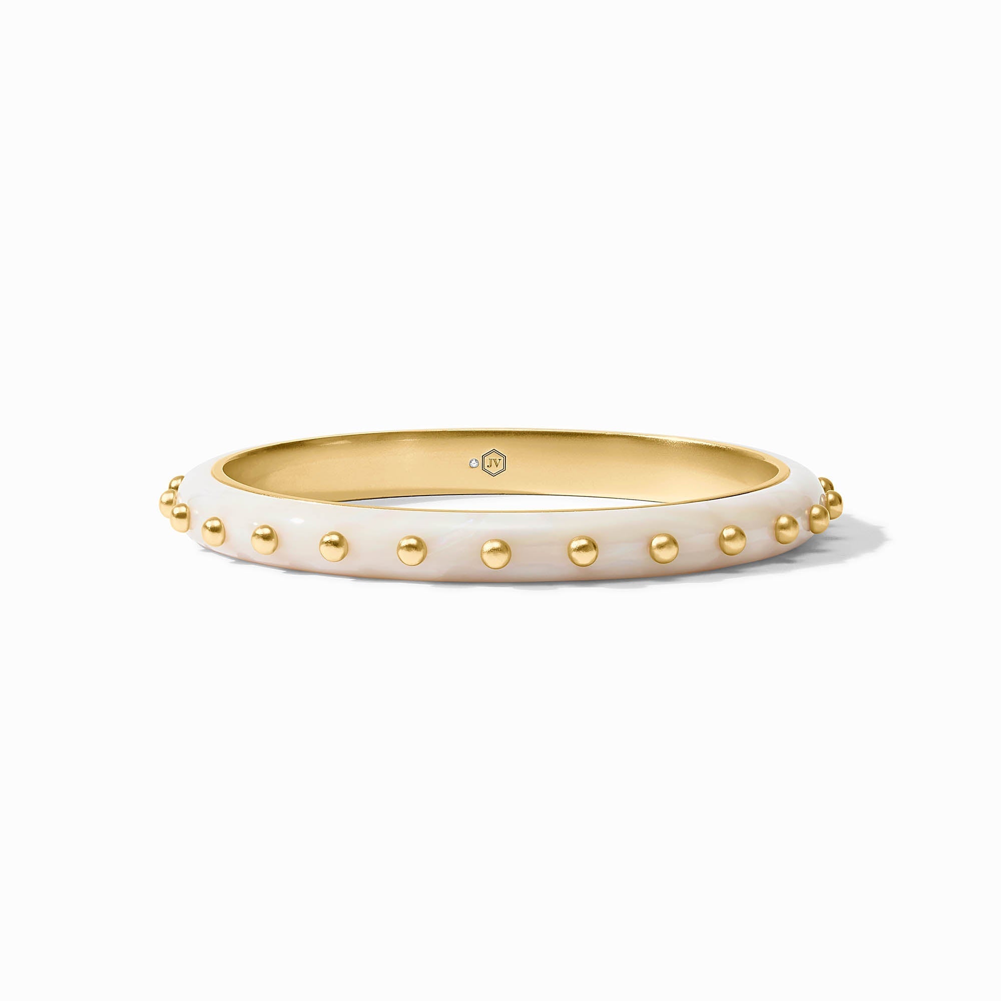Gold-studded white bangle on a white background