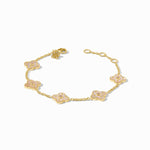 Gold bracelet with floral designs on a white background