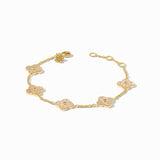 Gold bracelet with floral designs on a white background