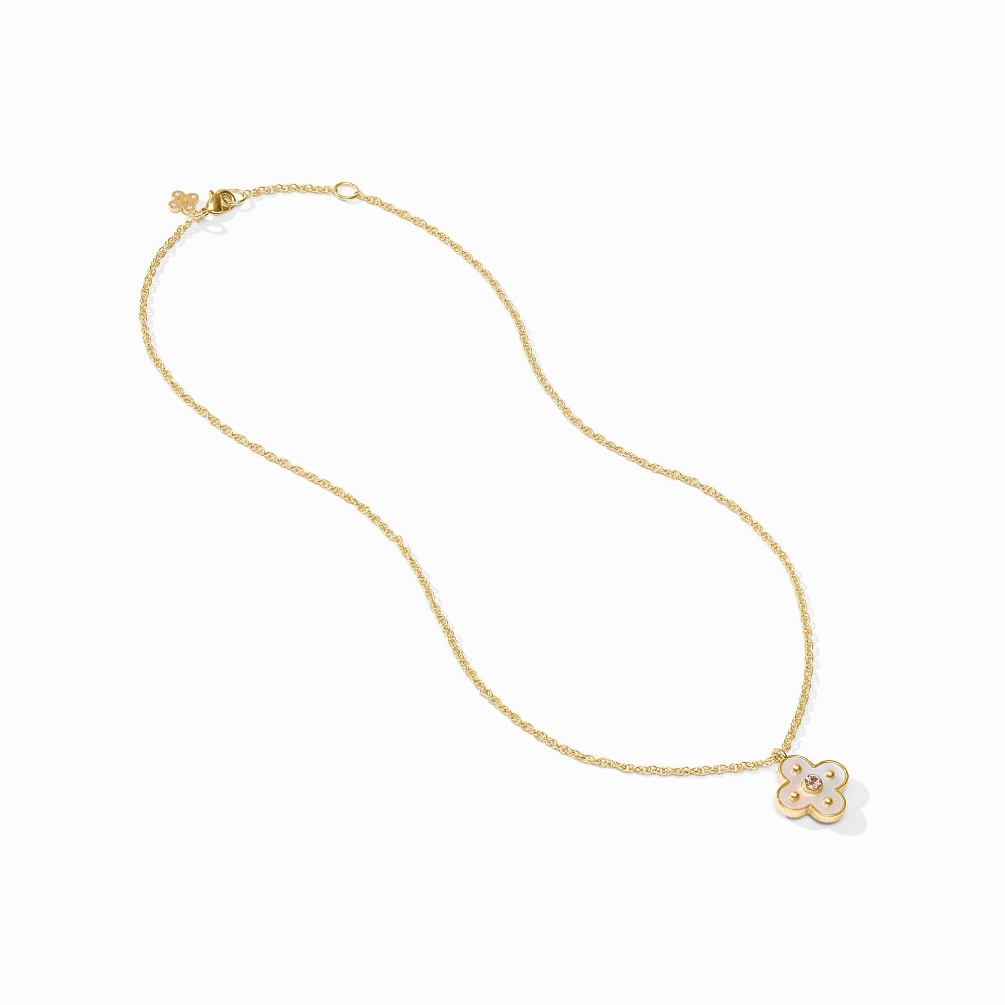 Gold necklace with a clover-shaped pendant on a white background