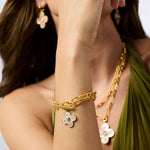 model wearing the Gold bracelet with a floral charm.