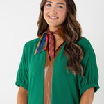 woman modeling a vintage monogram from Emily McCarthy scarf