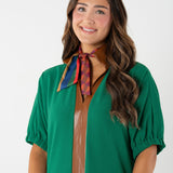 woman modeling a vintage monogram from Emily McCarthy scarf