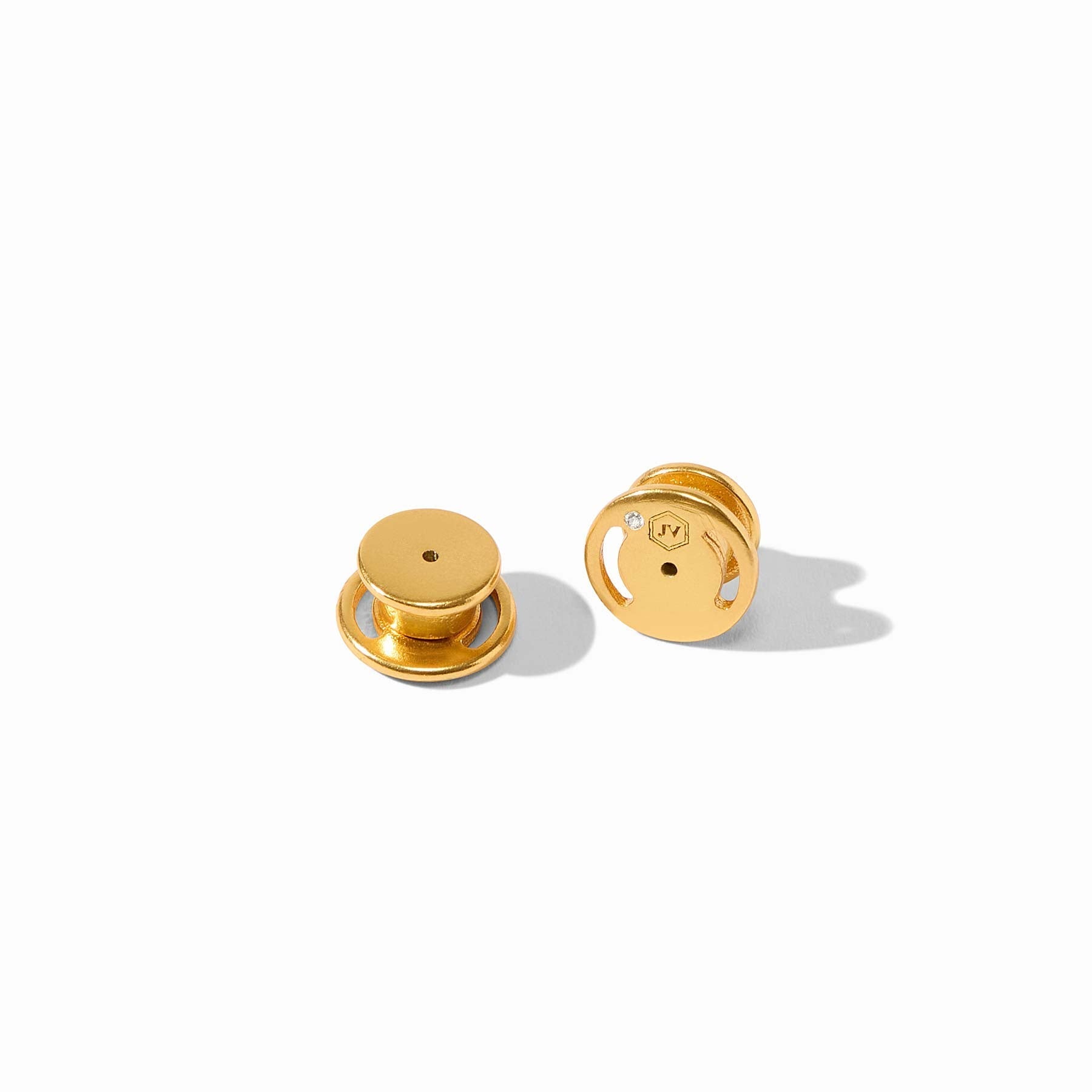 Pair of gold earrings on a white background