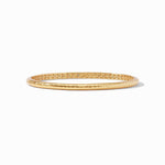 Gold bangle on a white background