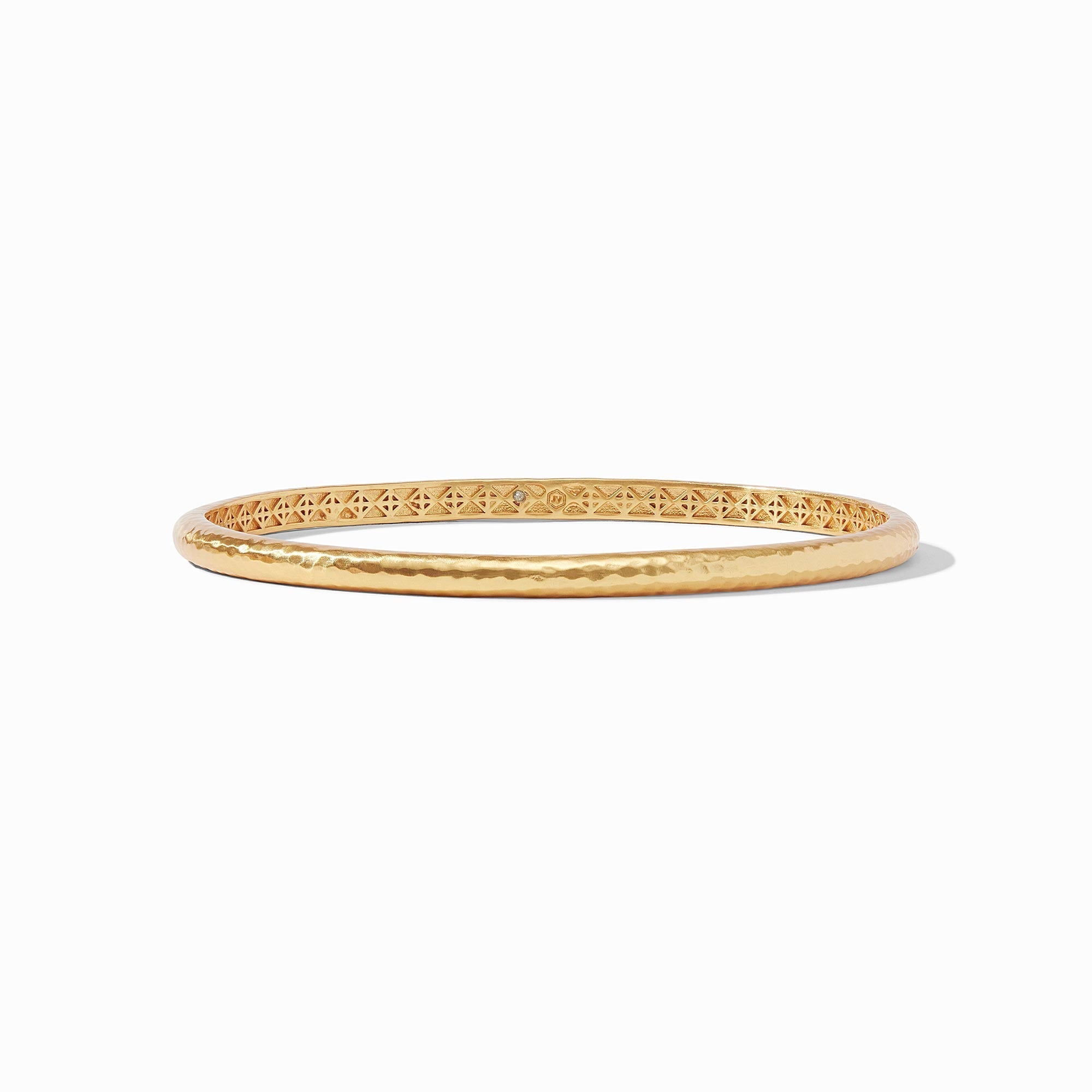 Gold bangle on a white background