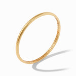 Gold bracelet on a white background