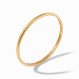 Gold bracelet on a white background