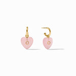 Heart-shaped pink earrings with gold hooks on a white background