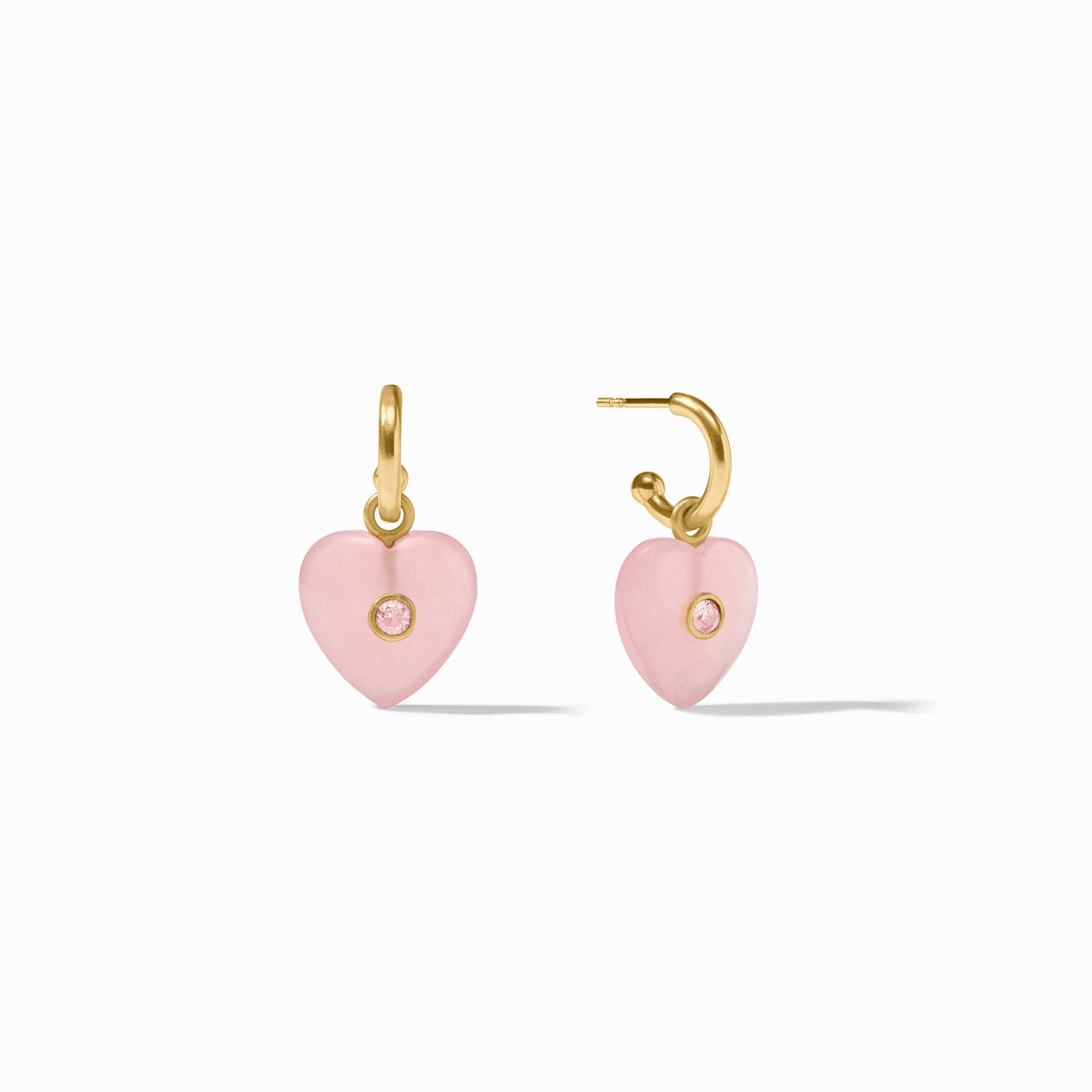 Heart-shaped pink earrings with gold hooks on a white background