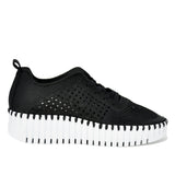 Black sneaker with white sole on a white background