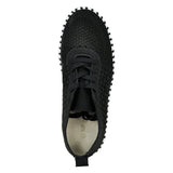 Black sneaker with textured sole on a white background