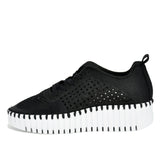 Black sneaker with a white sole on a white background