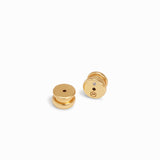 Pair of gold earrings on a white background
