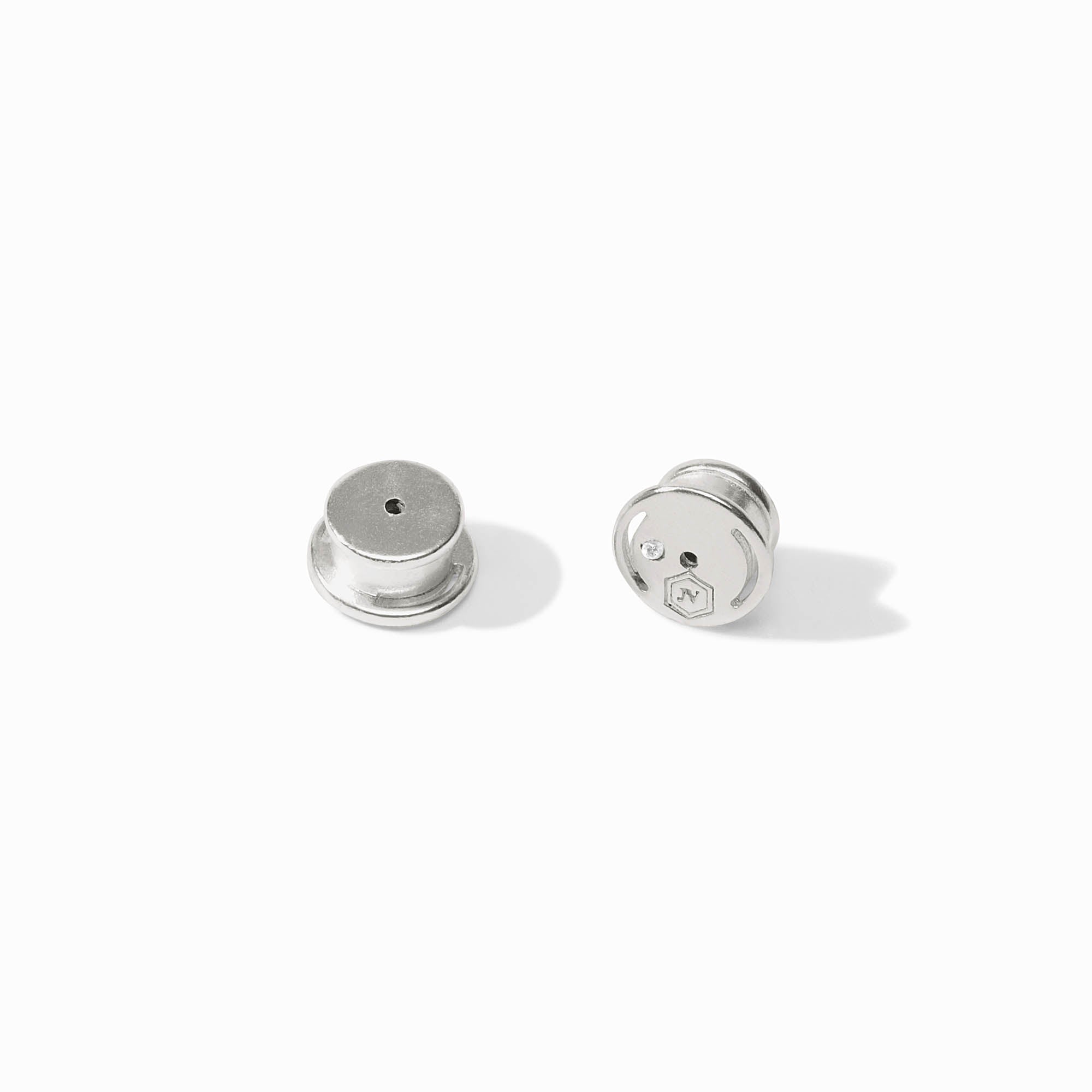Two silver round objects on a white background