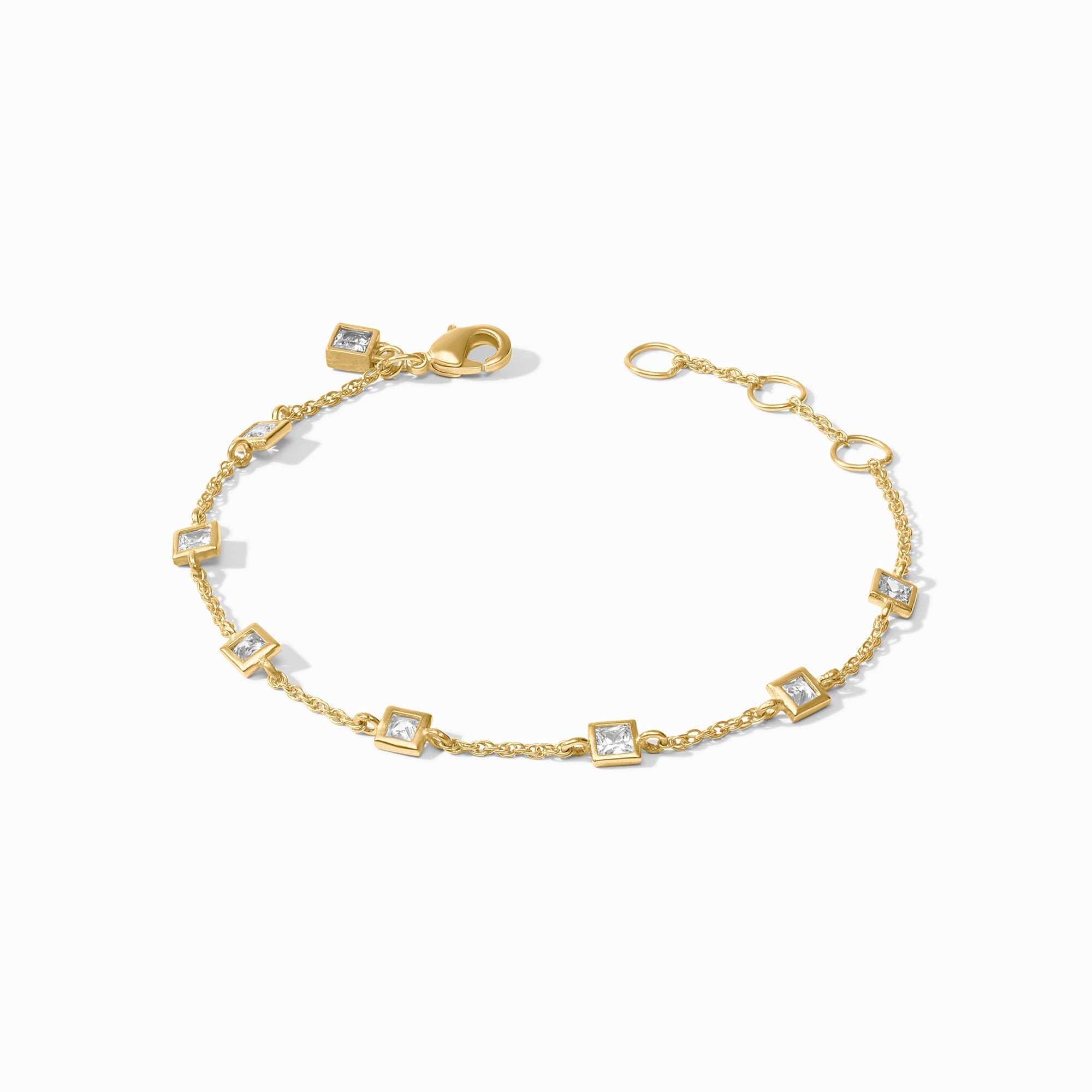 Gold bracelet with square links on a white background