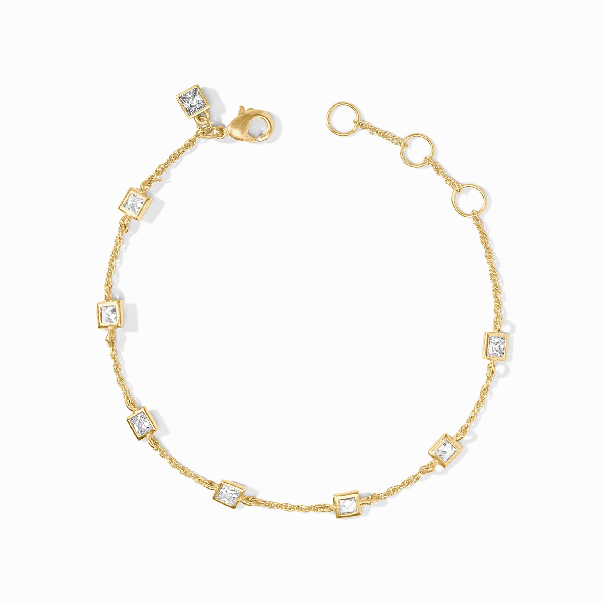Gold bracelet with square gemstones on a white background