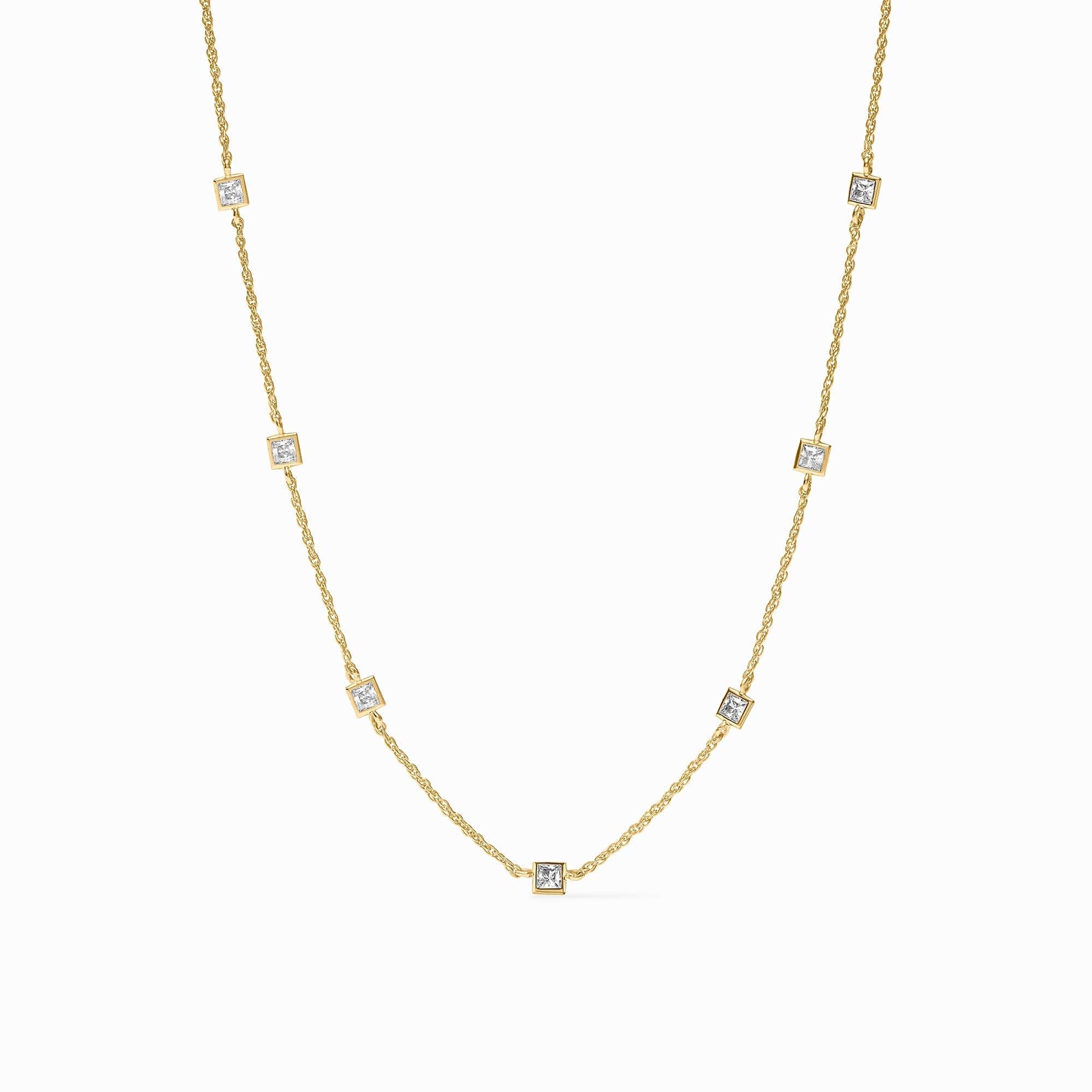Gold necklace with small diamonds on a white background