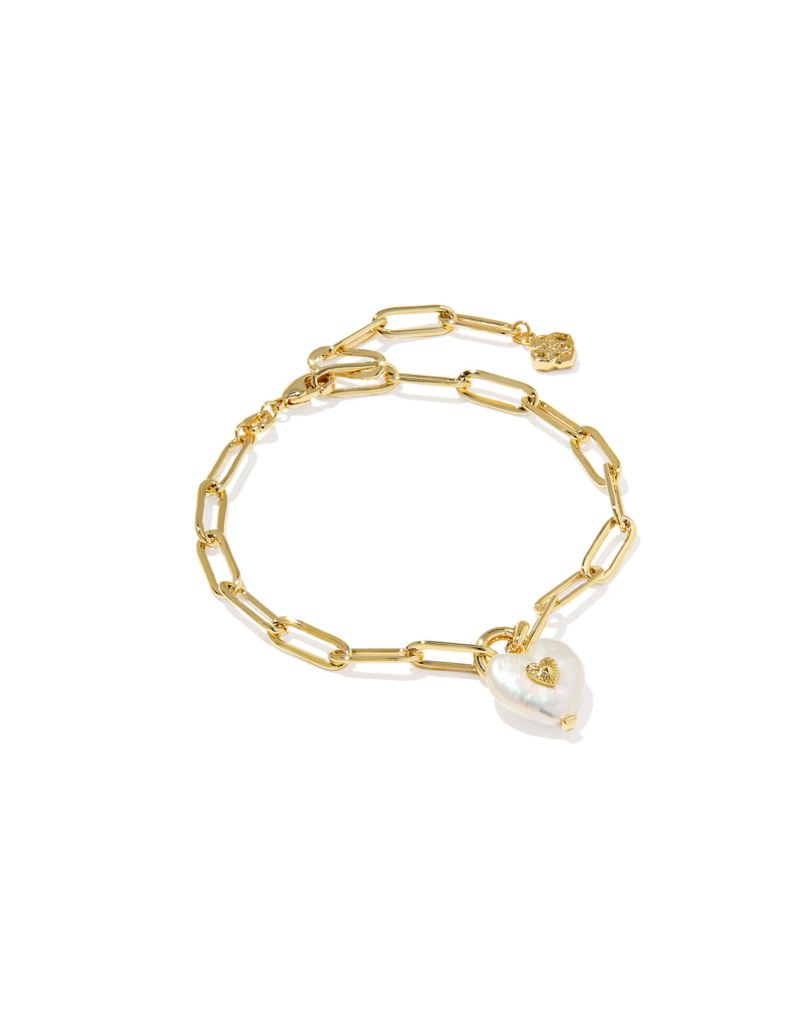 Gold chain bracelet with a heart-shaped pearl charm on a white background