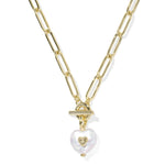 Gold chain necklace with a heart-shaped pearl pendant on a white background