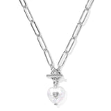 Silver necklace with a heart-shaped pendant on a white background