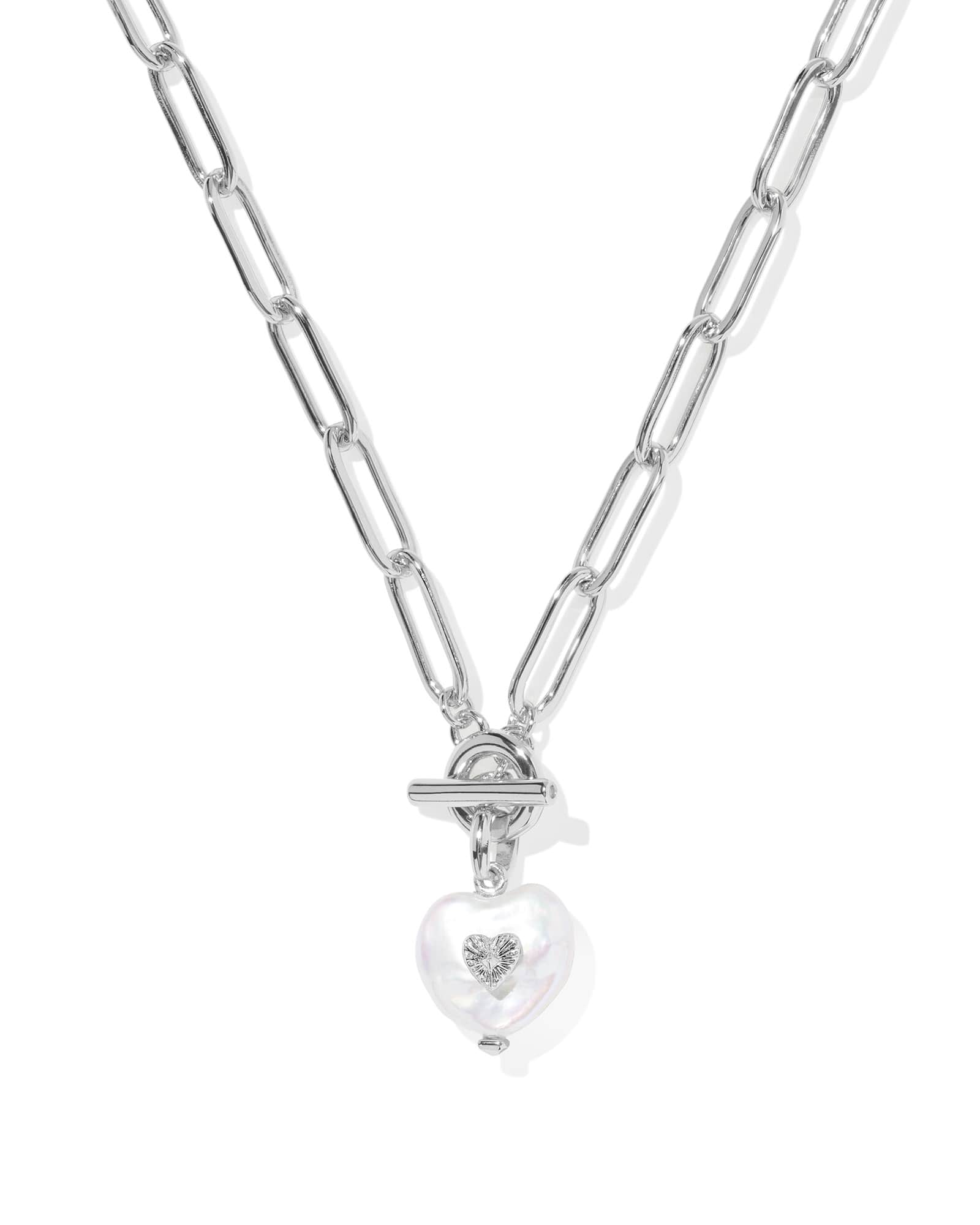Silver necklace with a heart-shaped pendant on a white background