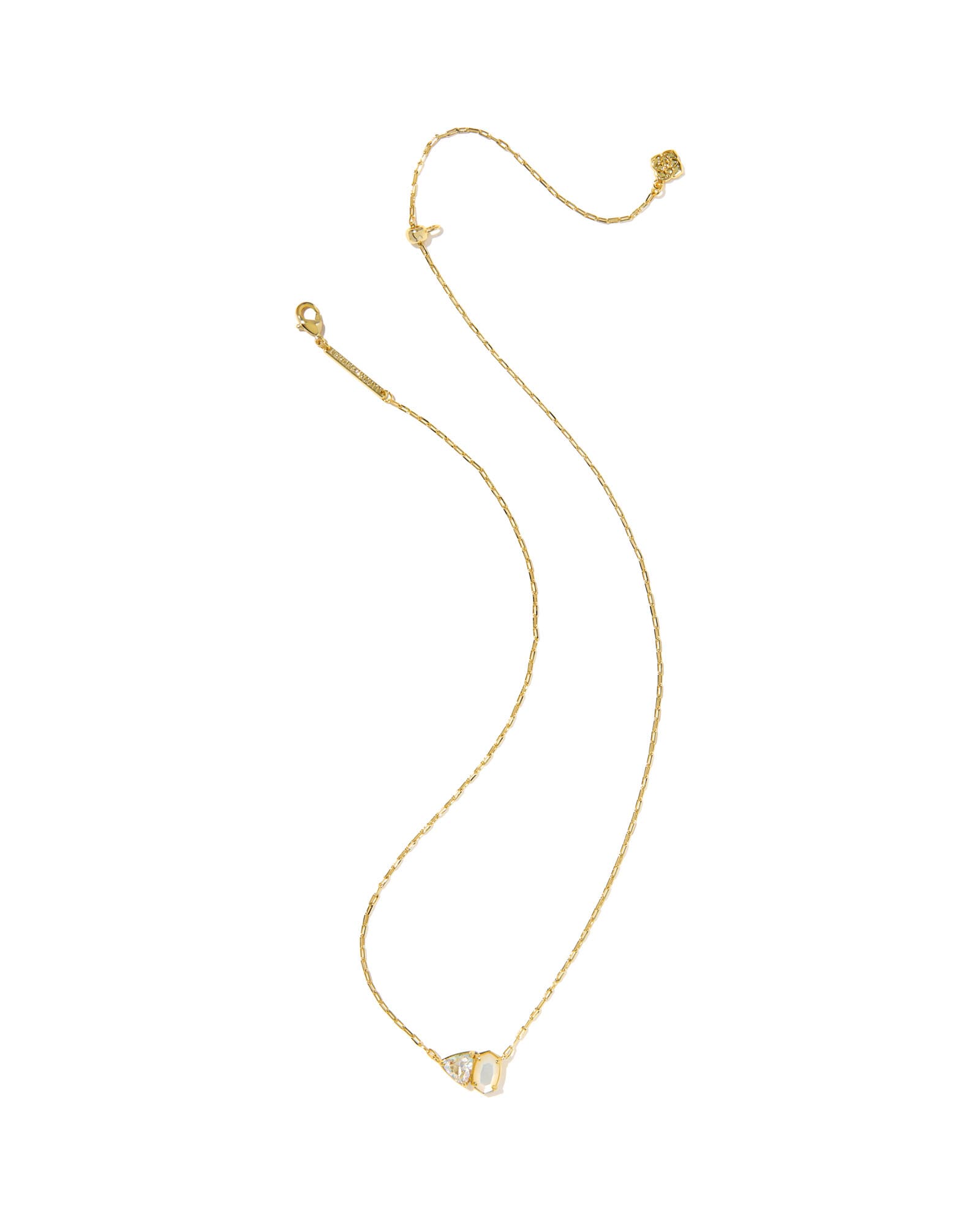 Gold necklace with a small pendant on a white background