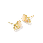 Gold earrings with clear gemstones on a white background
