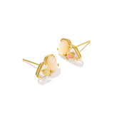 Gold earrings with clear gemstones on a white background