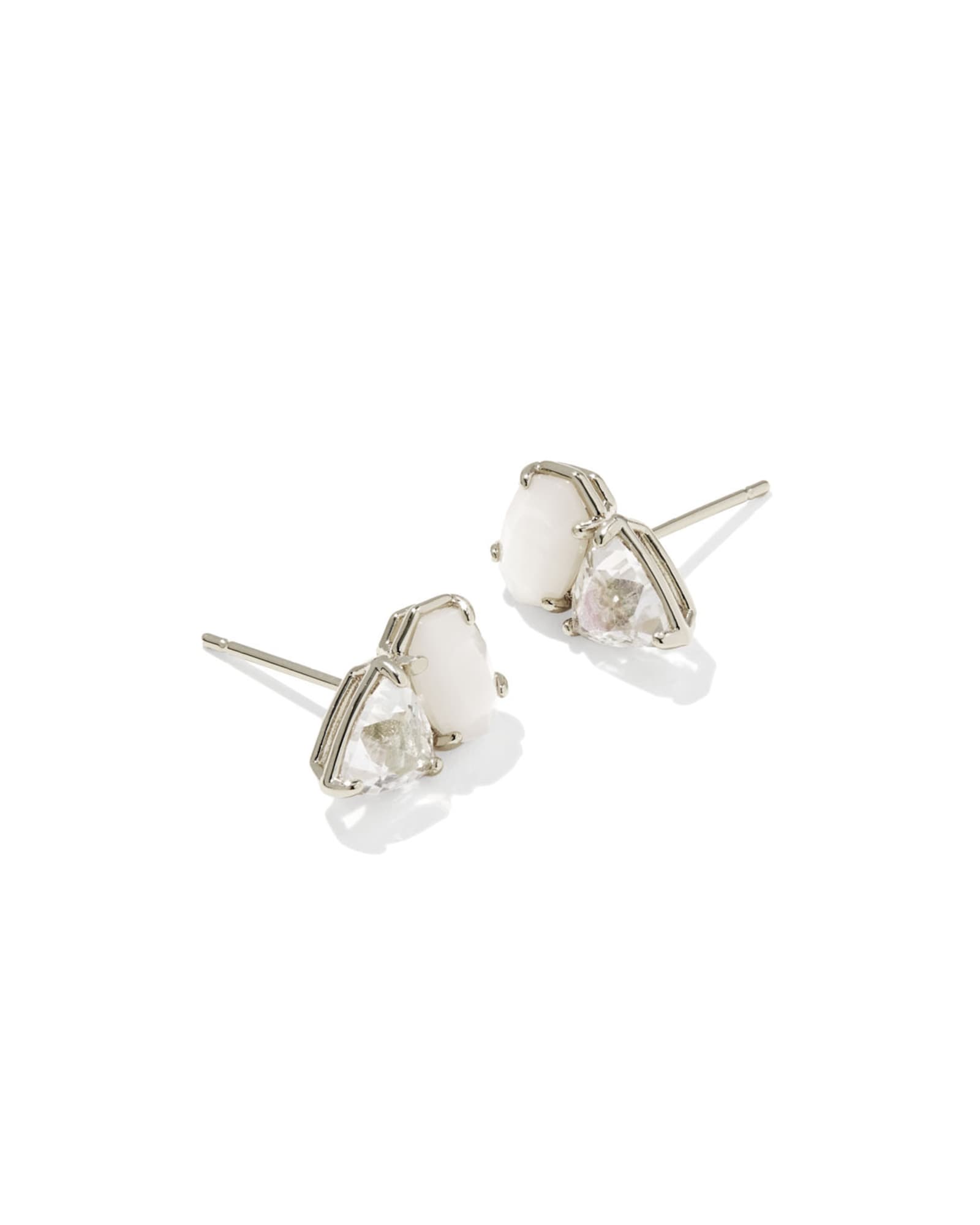 Pair of silver earrings with white gemstones on a white background
