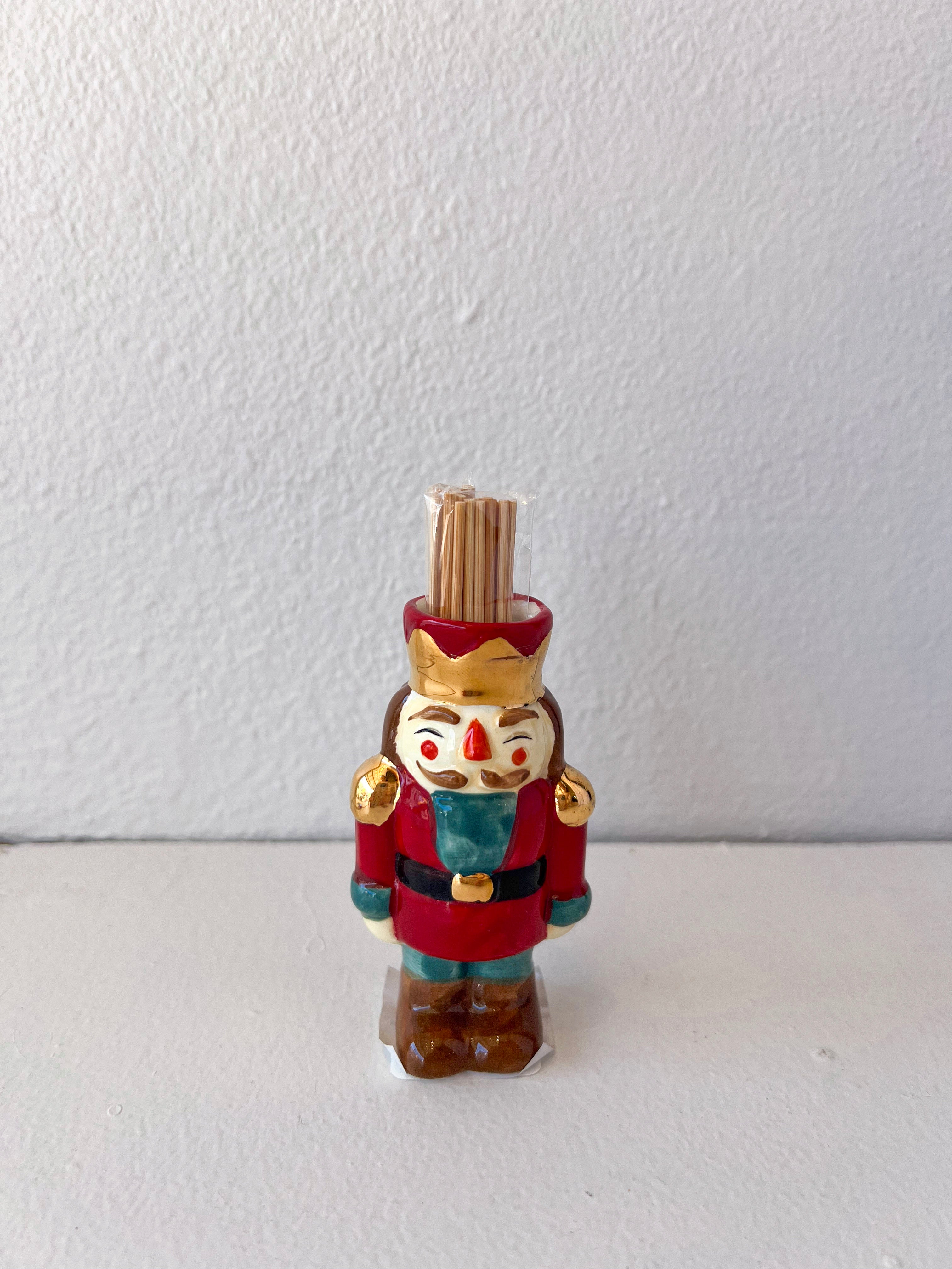Decorative figurine of a nutcracker with a white background