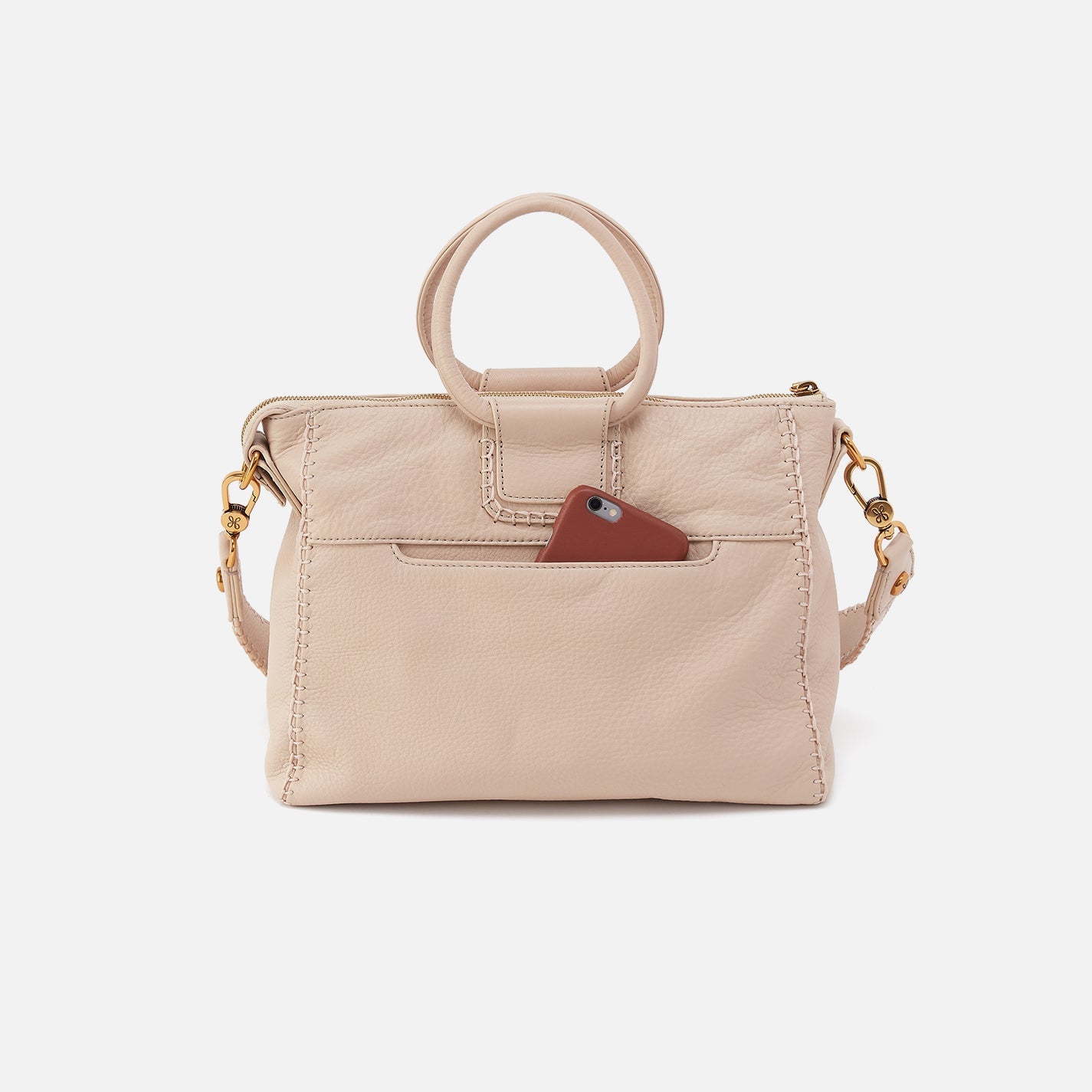 Beige handbag with a brown pocket on a white background