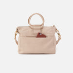Beige handbag with a brown pocket on a white background