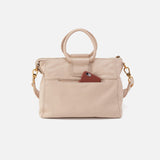 Beige handbag with a brown pocket on a white background