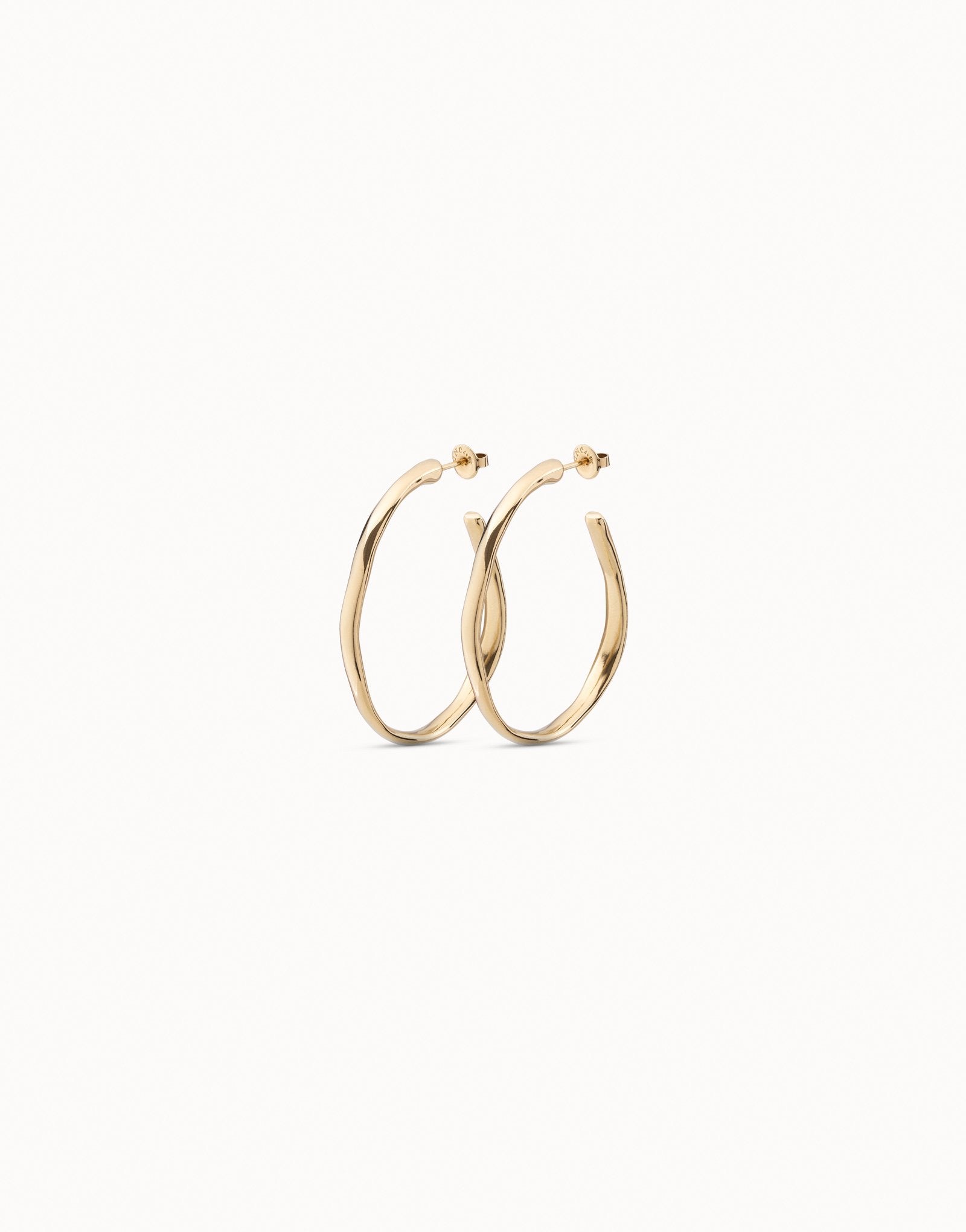Gold hoop earrings on a white background