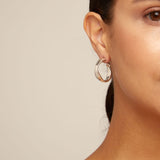 Silver hoop earrings on a white background