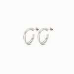 Silver hoop earrings on a white background