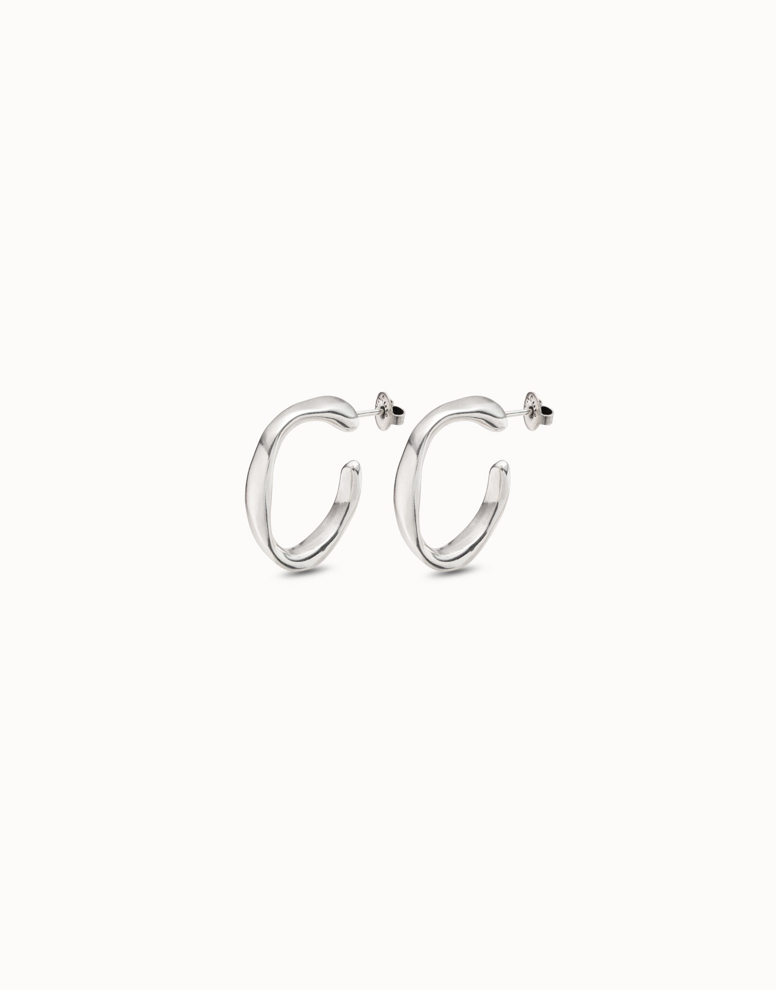 Silver hoop earrings on a white background