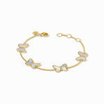 Gold bracelet with butterfly charms on a white background