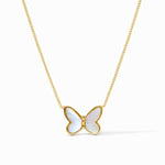 Butterfly-shaped pendant on a gold chain against a white background