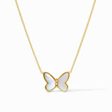 Butterfly-shaped pendant on a gold chain against a white background