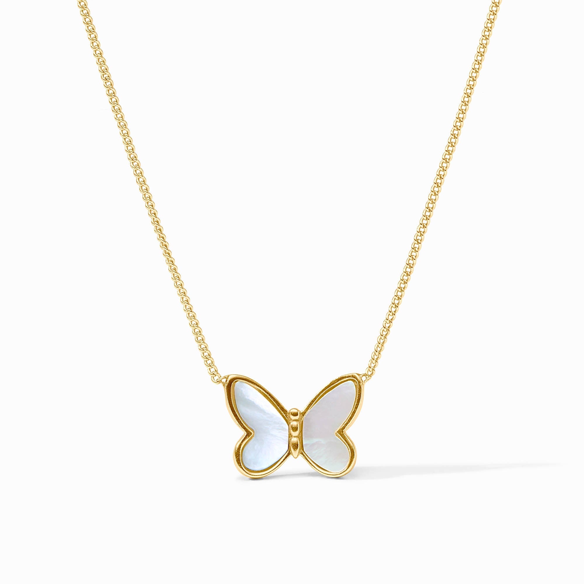 Butterfly-shaped pendant on a gold chain against a white background