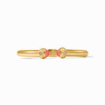 Gold bracelet with coral beads on a white background