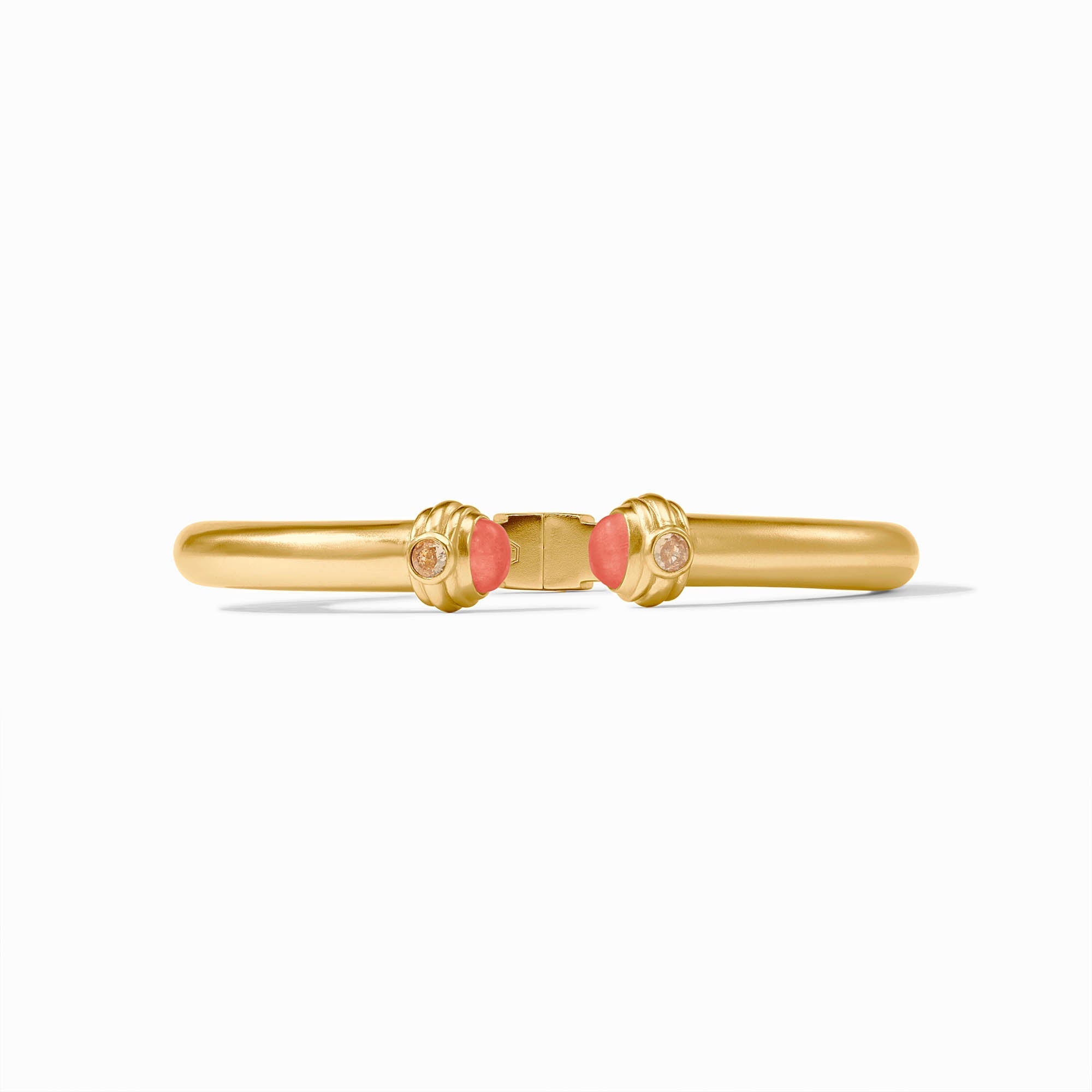 Gold bracelet with coral beads on a white background