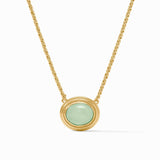 Gold necklace with a green pendant on a white background