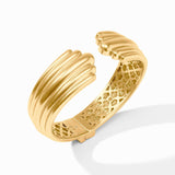 Gold bracelet with textured design on a white background