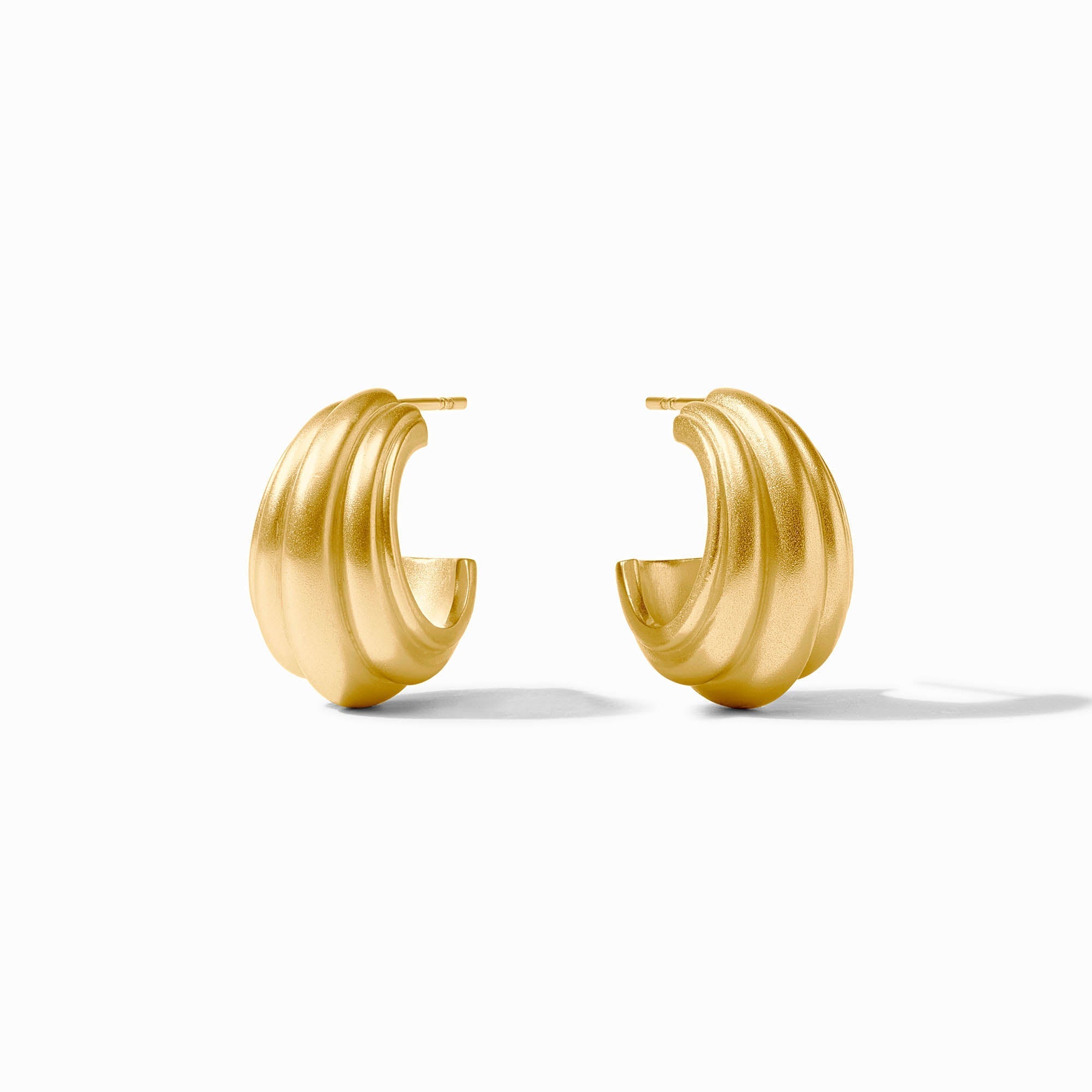 Gold hoop earrings on a white background