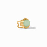 Gold ring with a light green gemstone on a white background