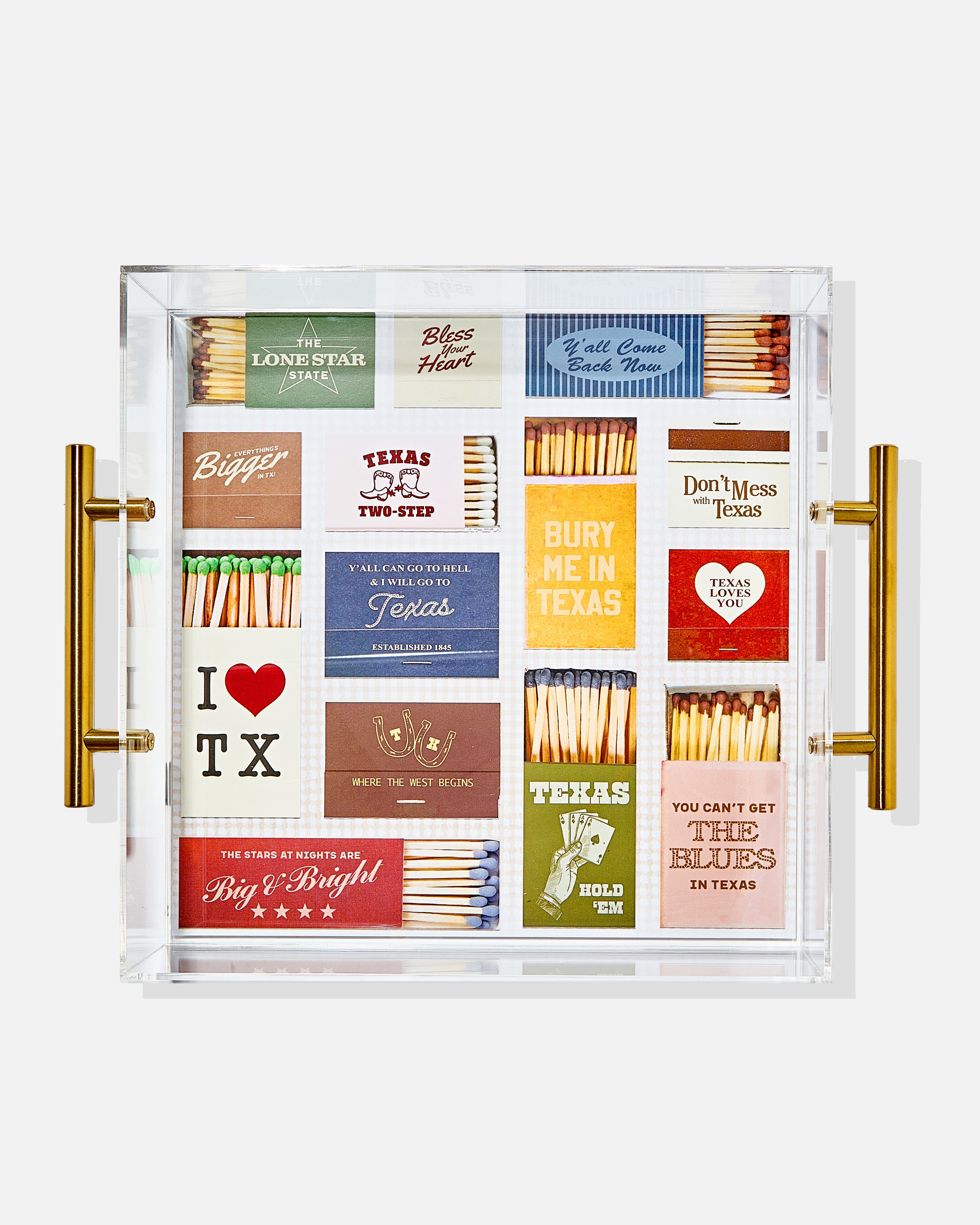 Collection of matches with Texas-themed designs in a decorative case.